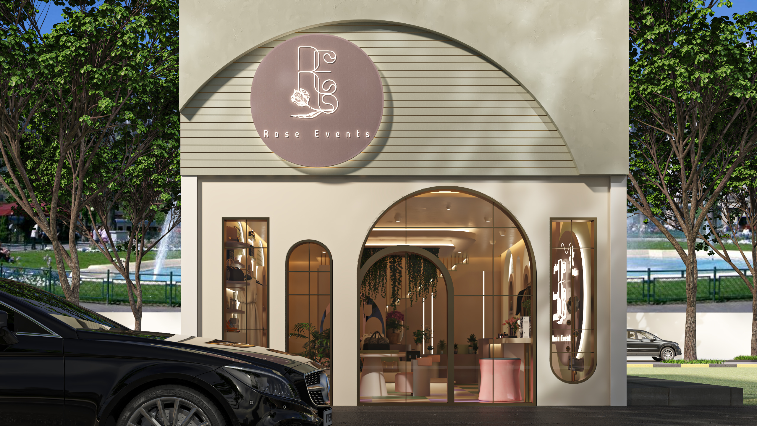 واجهة محل تجاري مودرن بتصميم أقواس زجاجية وشعار Rose Events المضيء